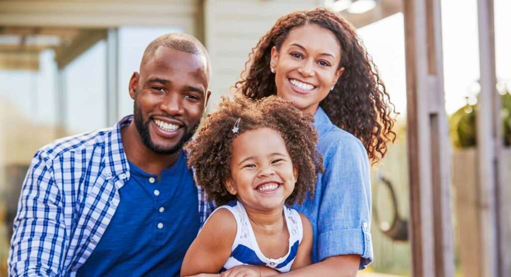 Young family posing for a group photo